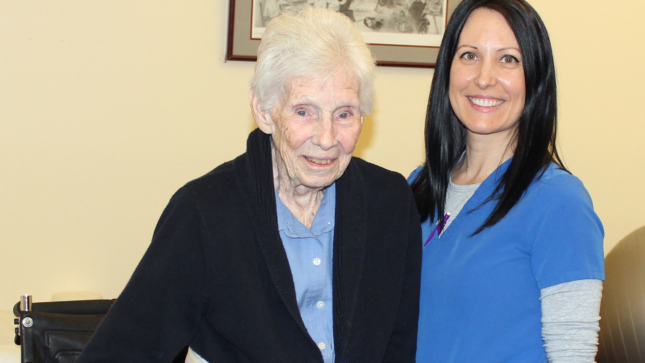 elderly woman and nurse in therapy